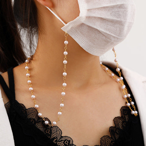 woman wearing pearl face mask chain