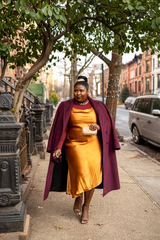 woman wearing slip dress to date night during winter season