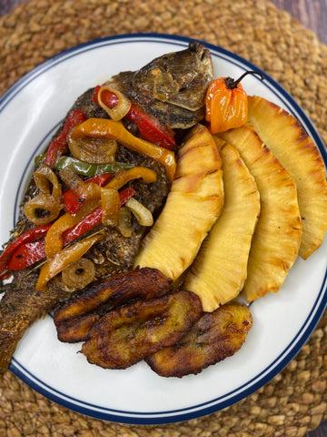 A plate of roasted jackfish and roasted breadfruit - the national dish of St Vincent.