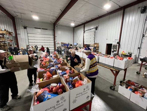 Volunteers for Elks Muskegon Food Basket program filling boxes with food