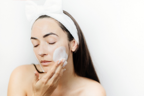 Woman using a Cleanser