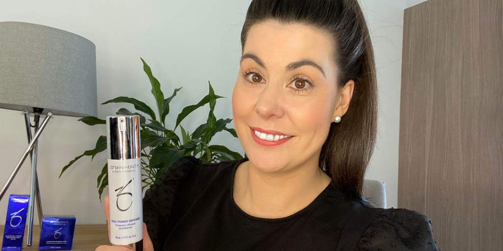 Our Skin Expert Michelle holding ZO Skin Health Daily Power Defense