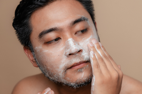 Man Cleansing face