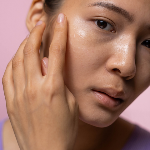 Woman applying serum