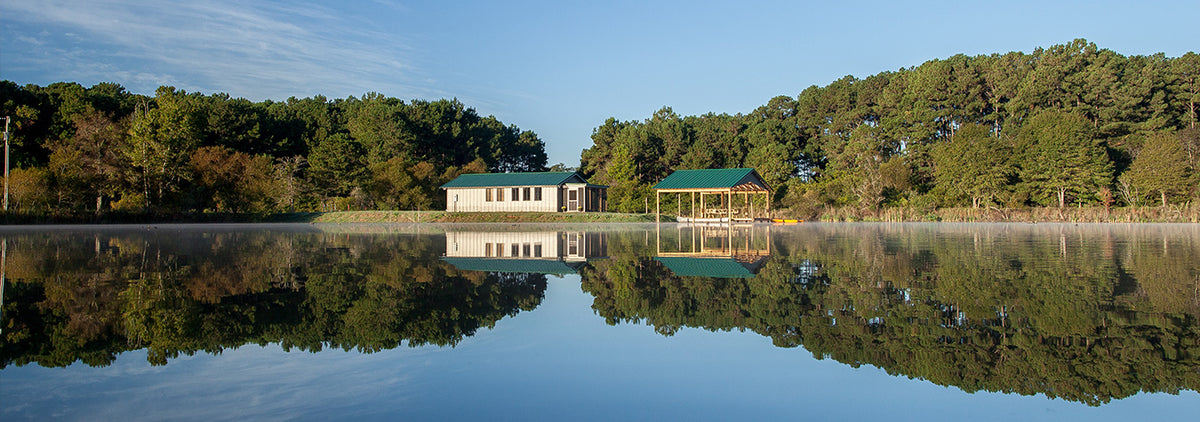 On-farm cabin available for rental that is situated on a pond