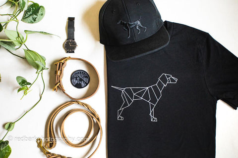 Origami dog Black Tshirt with puff embroidery black hat in a flat lay