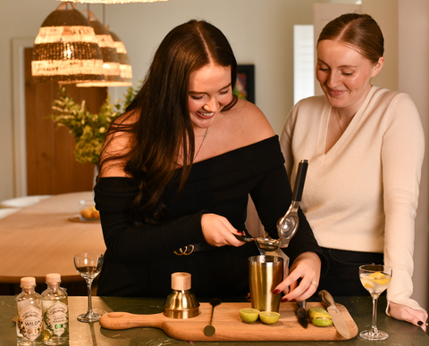 Isobel and Imogen Armstrong enjoying making cocktails with the Secret Garden Distillery's premium gins
