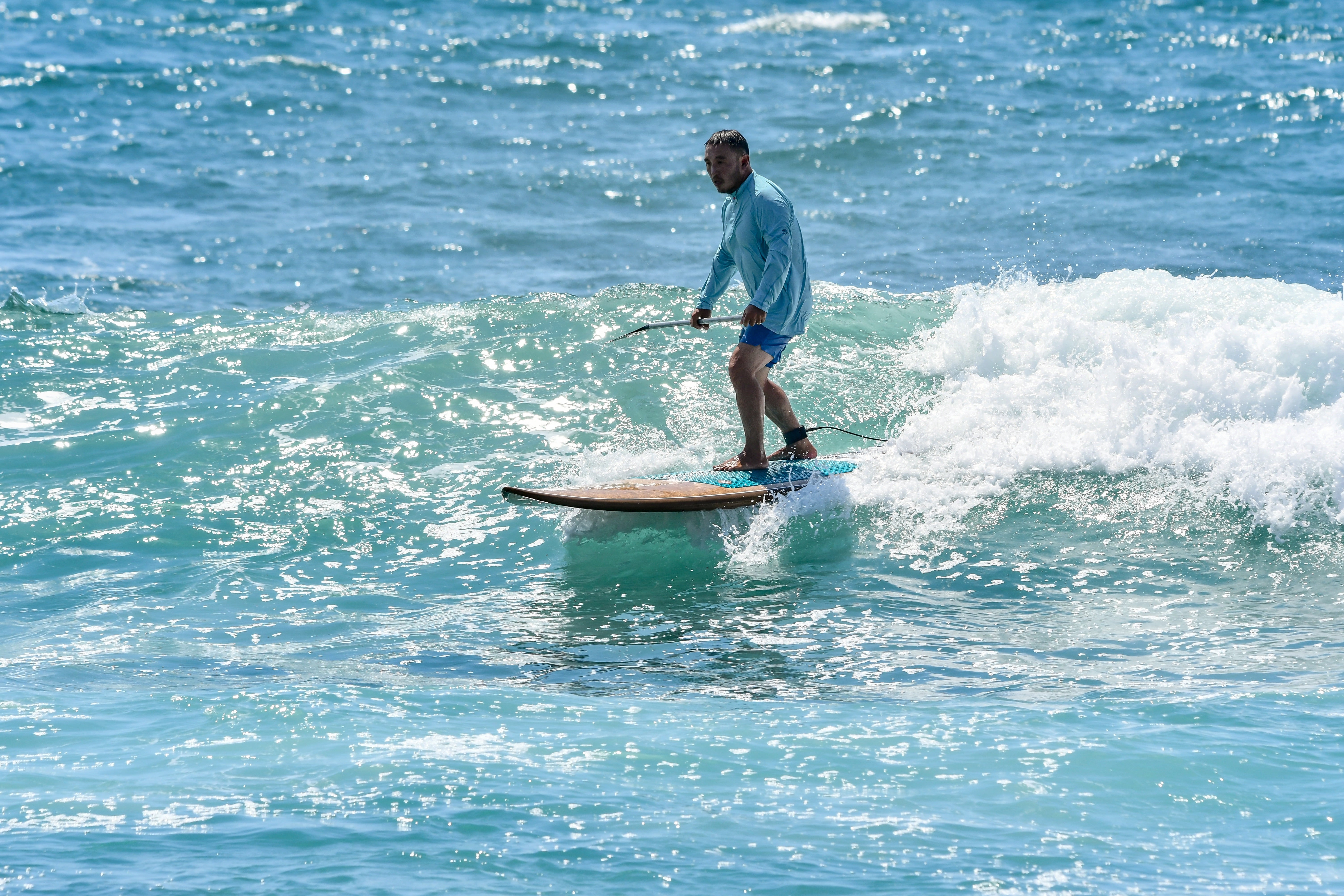 image of sup paddle board surfer