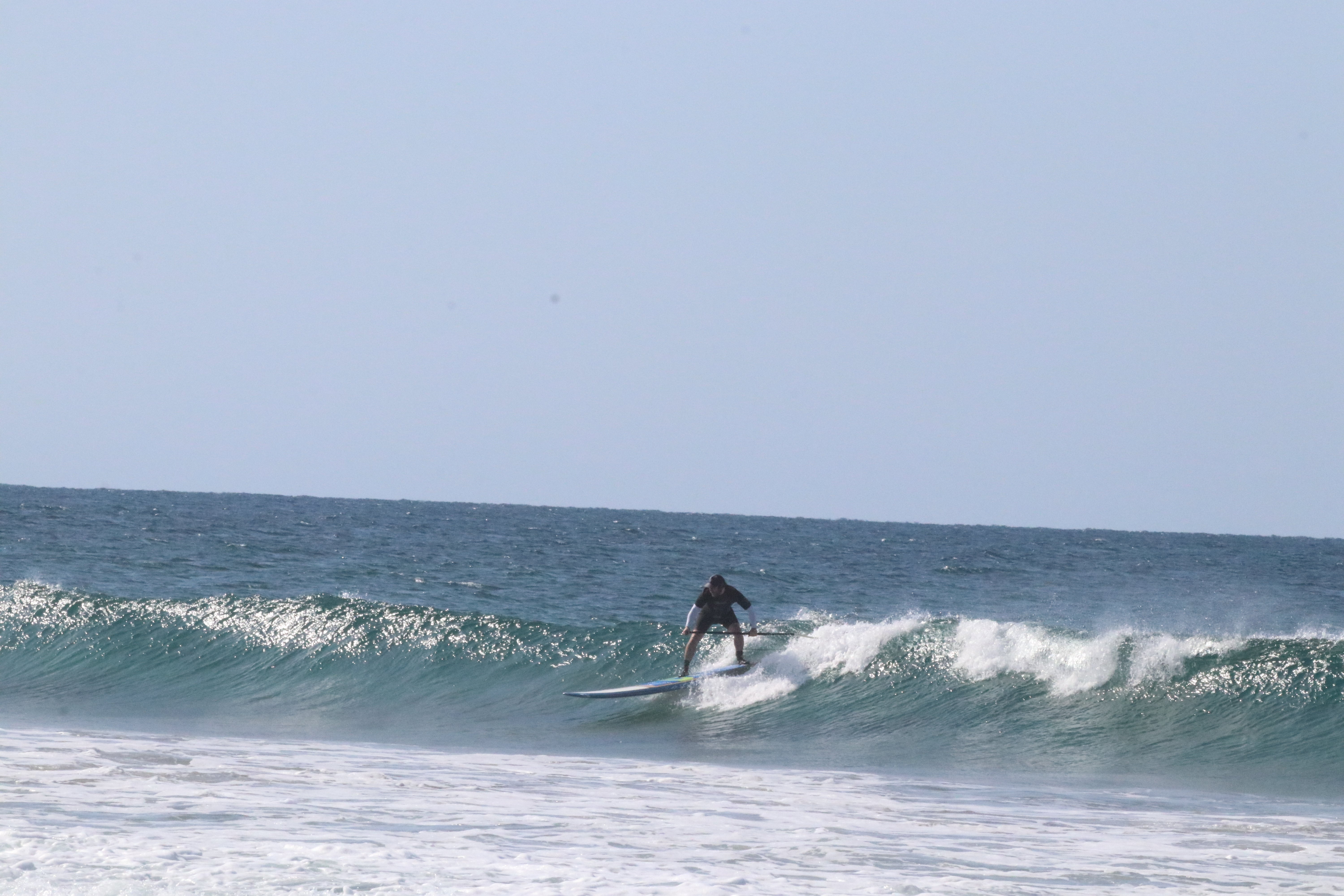 image of sup paddle board surfer