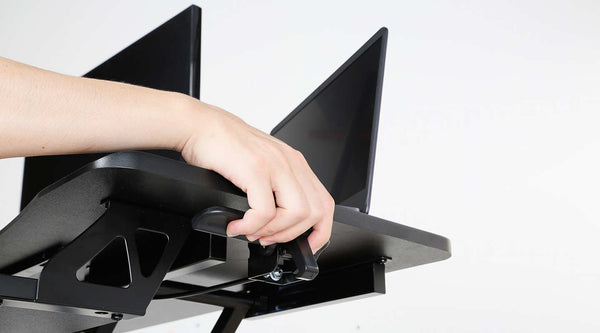 sit stand desk converter lifts to desired heights easily