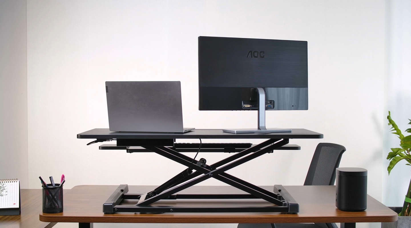 stand up desk converter with larger desktop gives more space