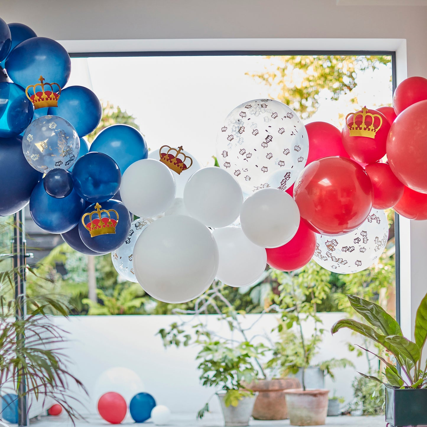 red, white, and blue balloon arch 