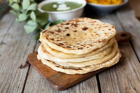 Paratha placed on a wooden board