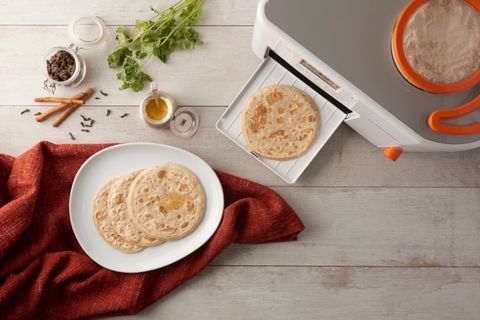 hot fluffy rotis coming out of Rotimatic