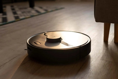vaccume robot cleaner on the wooden floor