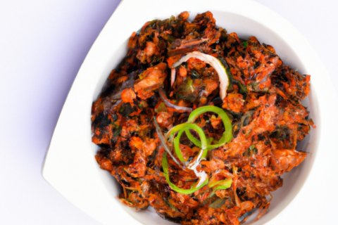 stir fried chicken on a white plate