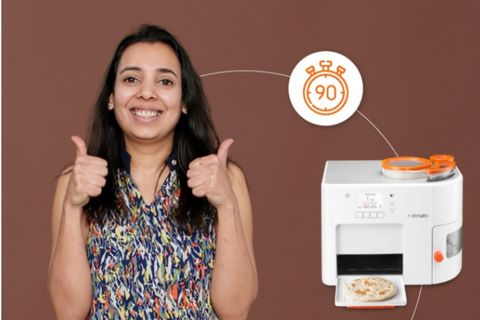 girl happy with Rotimatic rotis in 90 seconds
