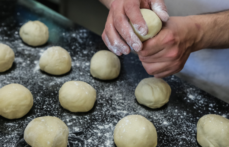 making dough balls for rotis