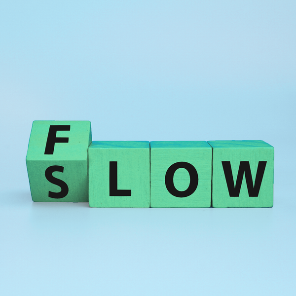 image with a blue background and blocks with letters saying Slow and Flow