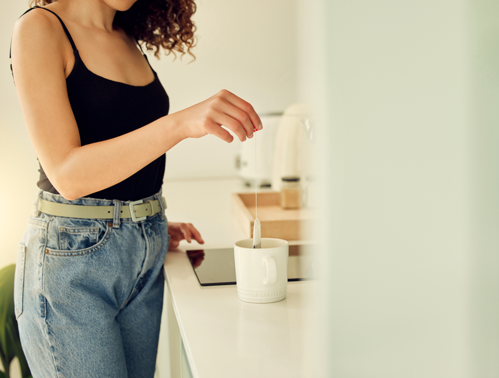 Woman holding tea bag