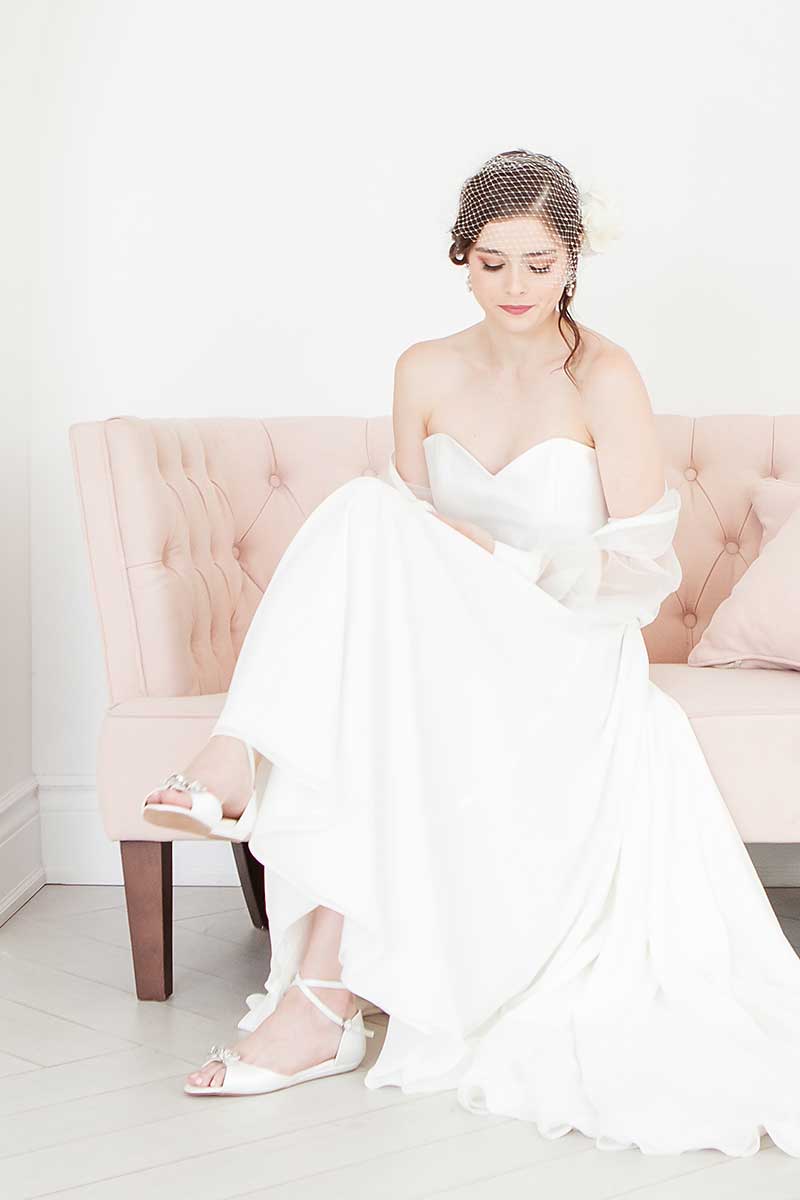 Angela Nuran Audrey flat wedding shoes on bride with birdcage veil
