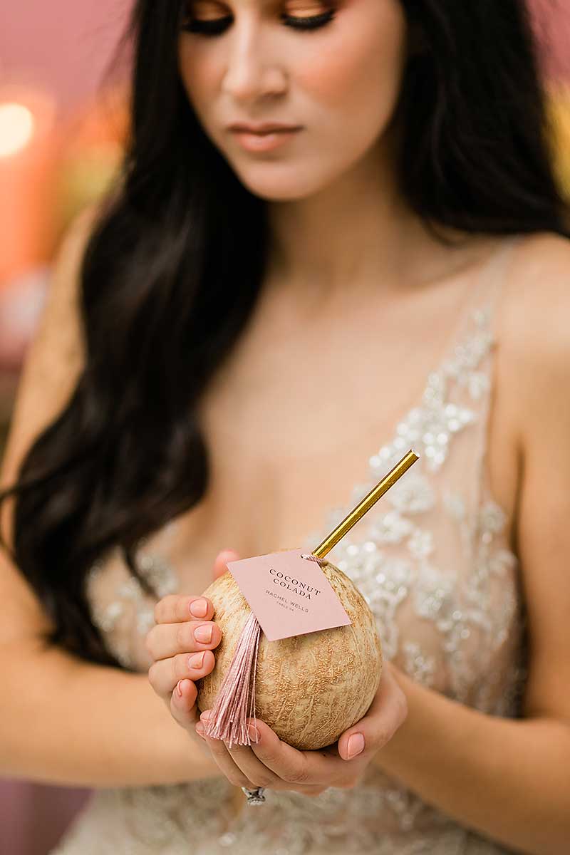 destination wedding bride holding a cocktail drink