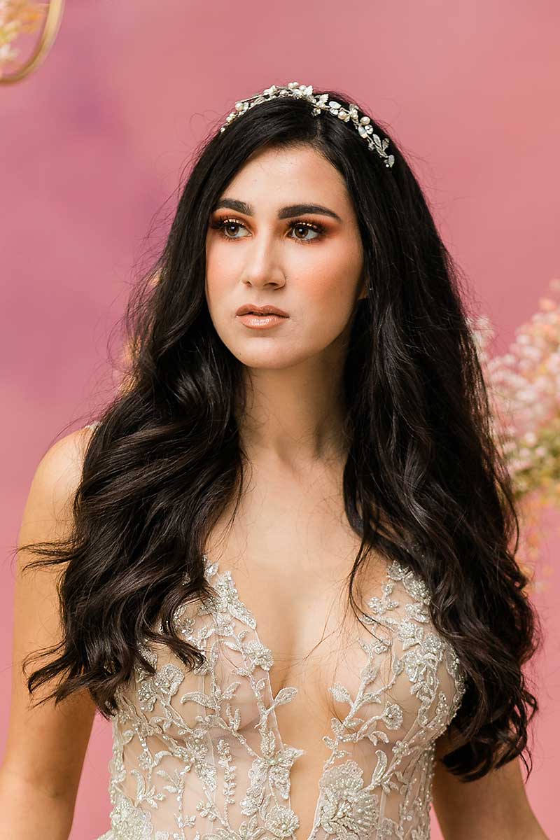 Bride wearing beachy waves with foliage crown