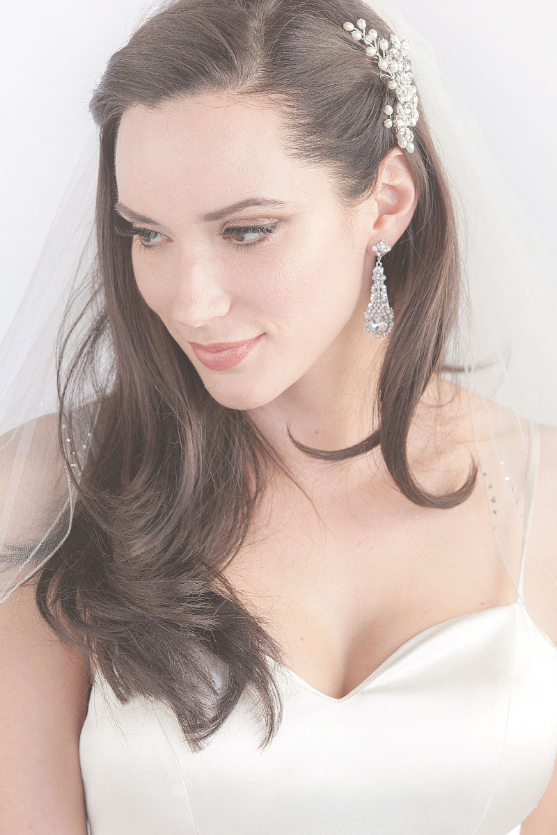 Side view of bride wearing a hair vine with beaded Corsica Two Tier Fingertip Veil by Laura Jayne. 
