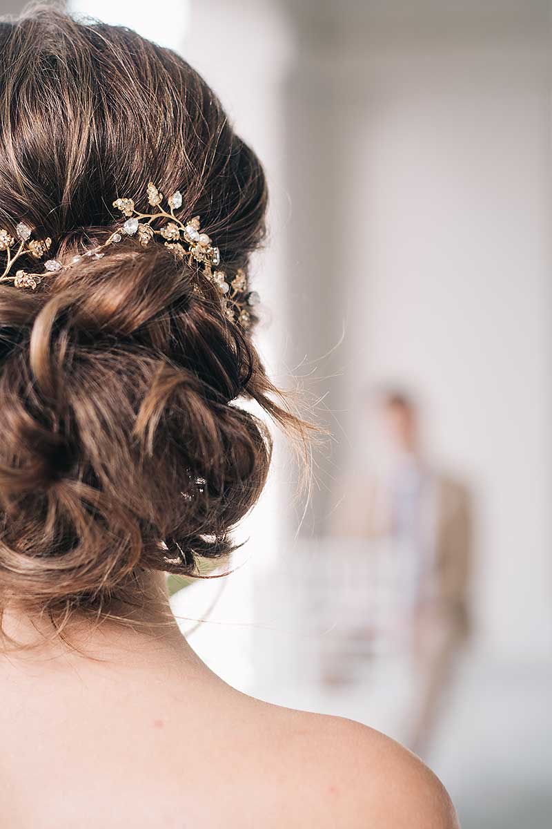 back view of messy bun hairstyle with Laura Jayne Wisteria hairvine