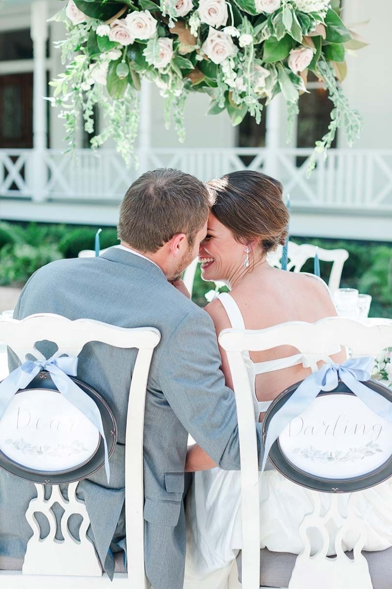 couple sitting at the wedding table 