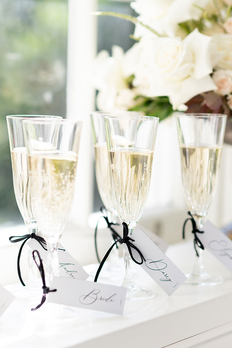 Champagne flutes with black ribbon and b&w stationery