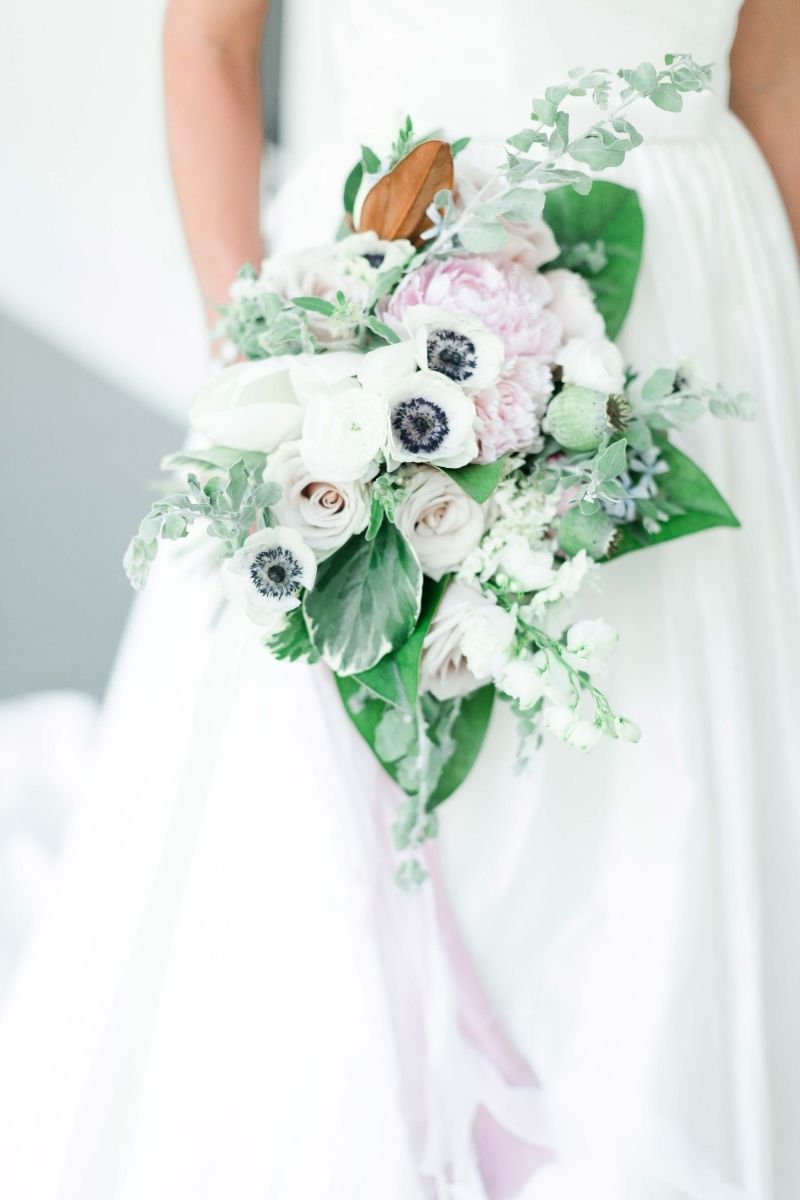 half of the wedding dress and a lower bouquet 