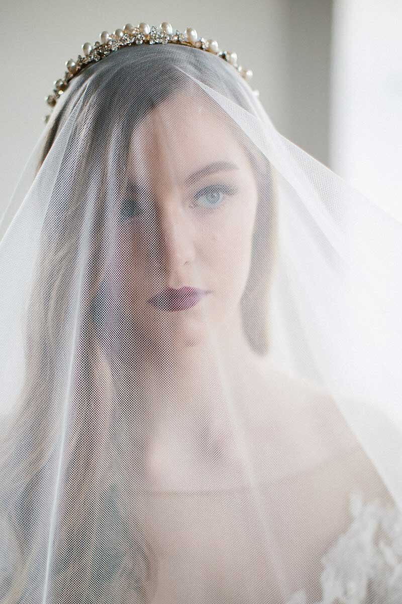 model wearing silky tulle drop veil 