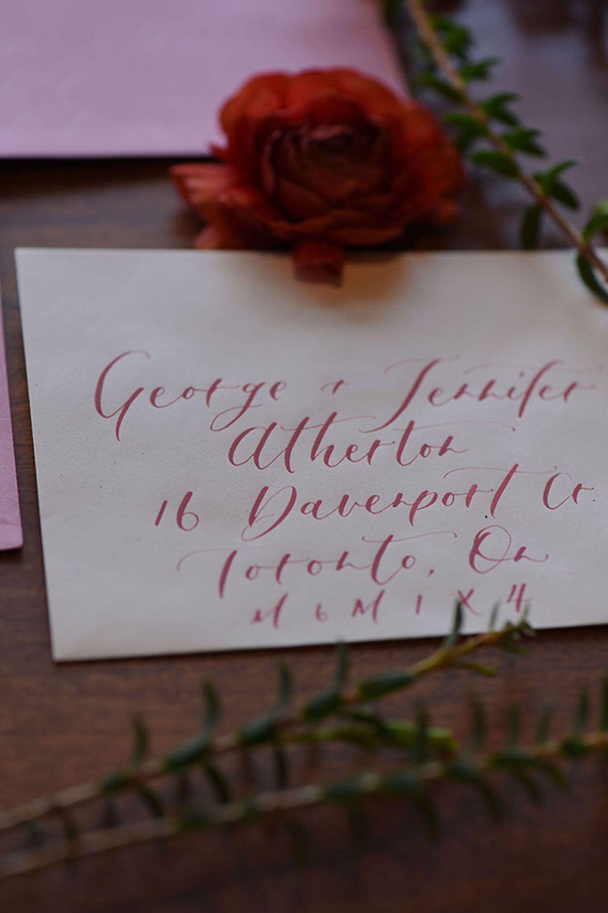 wedding vows handwritten with rose on top
