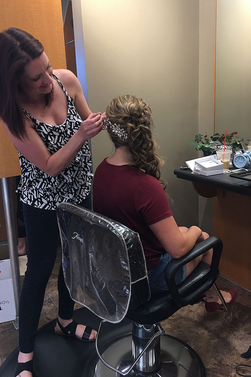 hair stylist placing accessories at bridal hair trial