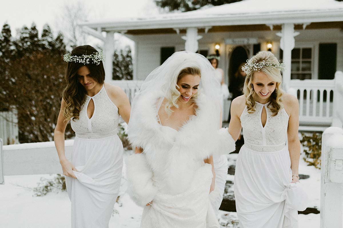 happy bride with bridesmaids, winter wedding 