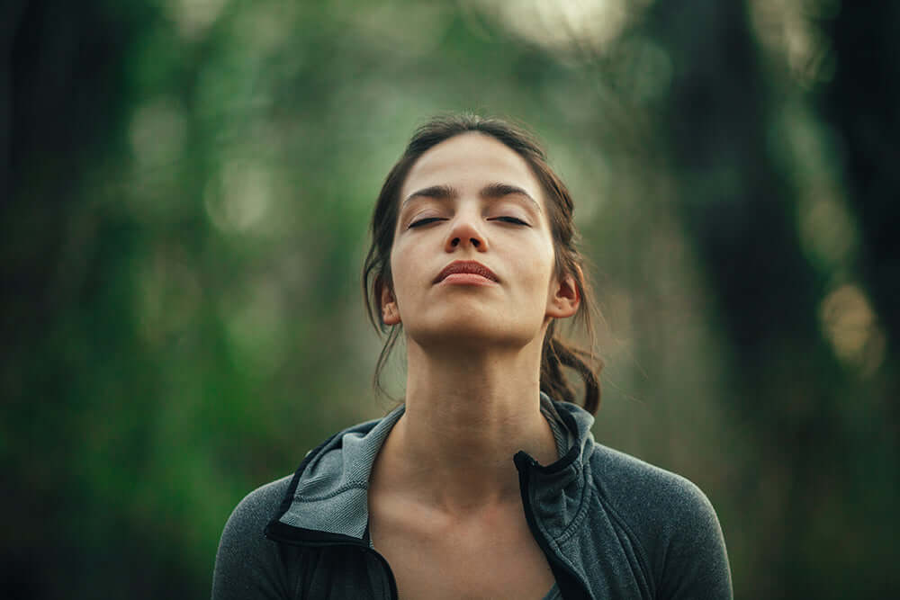 woman practicing breathing techniques