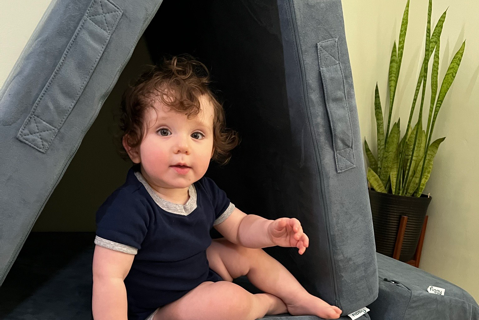 toddler sitting on a Figgy play couch