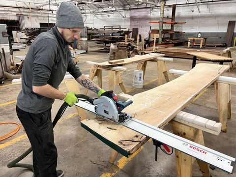 Employee Cutting Wood