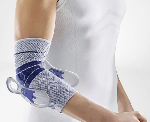 Person wearing Bauerfeind's EpiTrain, a great brace for recovering from tennis elbow. The shot focuses on the brace, with only the person's arm and torso visible.