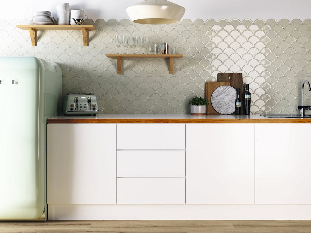 White kitchen with fishscale tiles