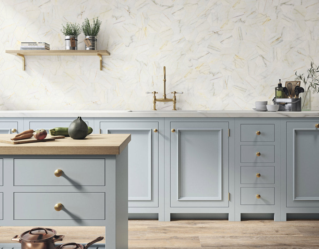 Wood tiles laid in a blue shaker kitchen with white marble wall tiles