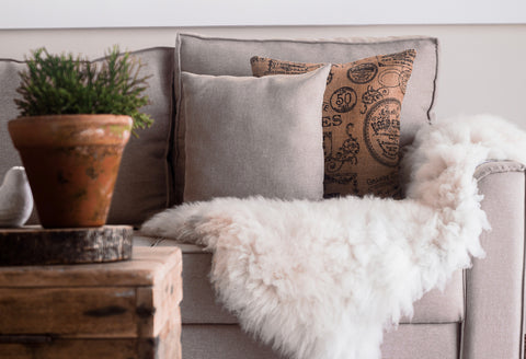 Add textured materials like jute, wool, fur to make home feel more cozy and inviting