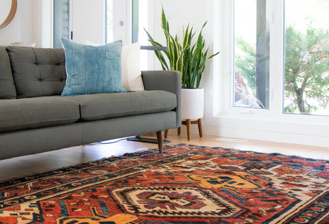 Use rugs to add textures and colours and create a focal point in your cozy space 
