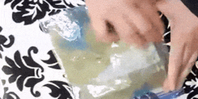 moving gif of hands closeup  wet felting rubbing wool with dish soap inside a ziplock bag