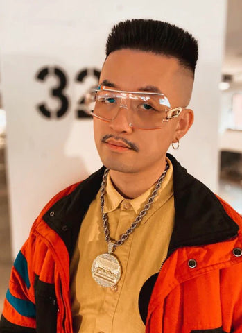 man wearing Cazal clear frame sunglasses with a flattop haircut