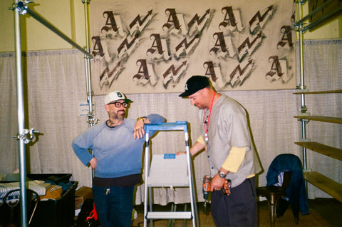 Excel and Frank building out the frame of the All Time High booth at the Inspiration show