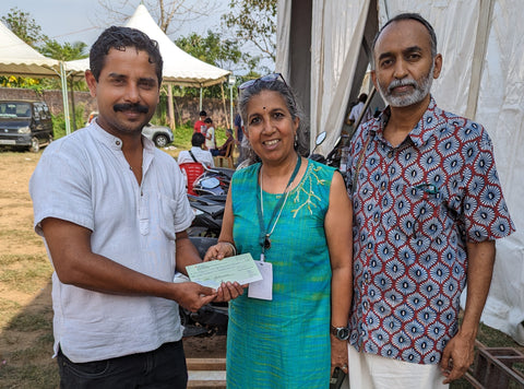 Ramesh Chandran and Devi Lakshmikutty Handing Over the Cheque at OFAI Meet, Kerala in Dec 2023
