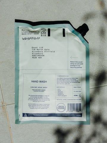 Back of a Reia refill pouch showing product information and a returns label