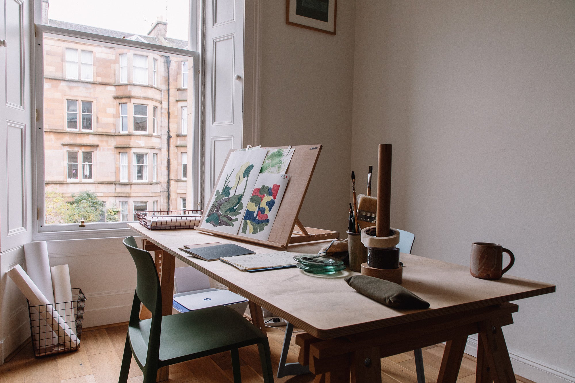 Artist desk with her work